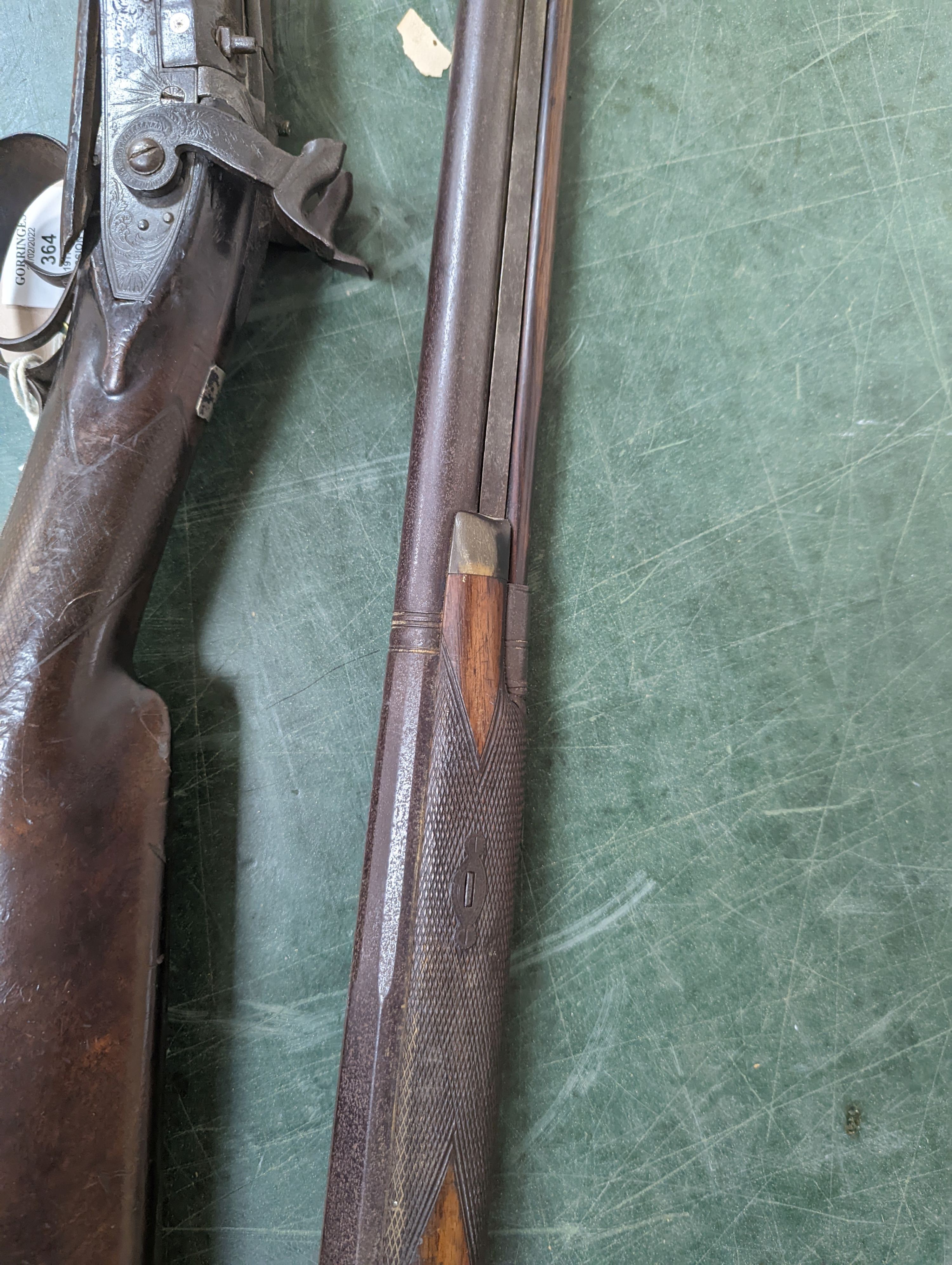 Two 19th century percussion muskets, 103cm. max., one double-barrelled